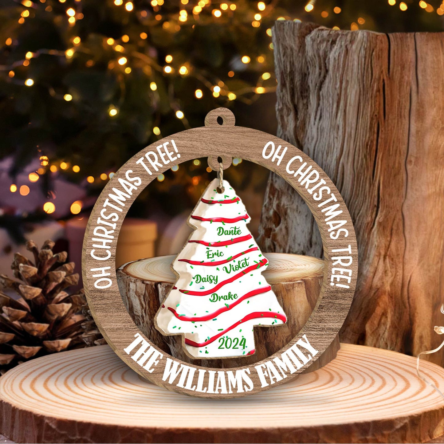 Personalized family Christmas ornament with names on a tree-shaped ceramic decoration and wooden ring frame