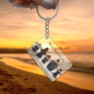Personalized family keychain with custom name design overlooking a beach sunset