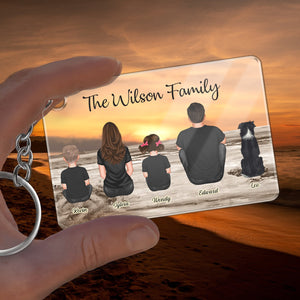 Personalized family keychain featuring silhouettes of the Wilson family at sunset