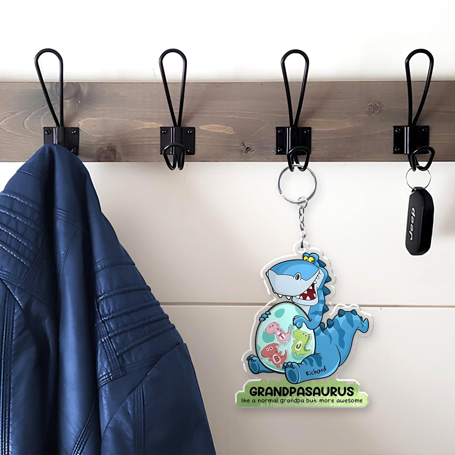 Personalized grandpa keychain featuring a fun dinosaur design, perfect for keys or bags