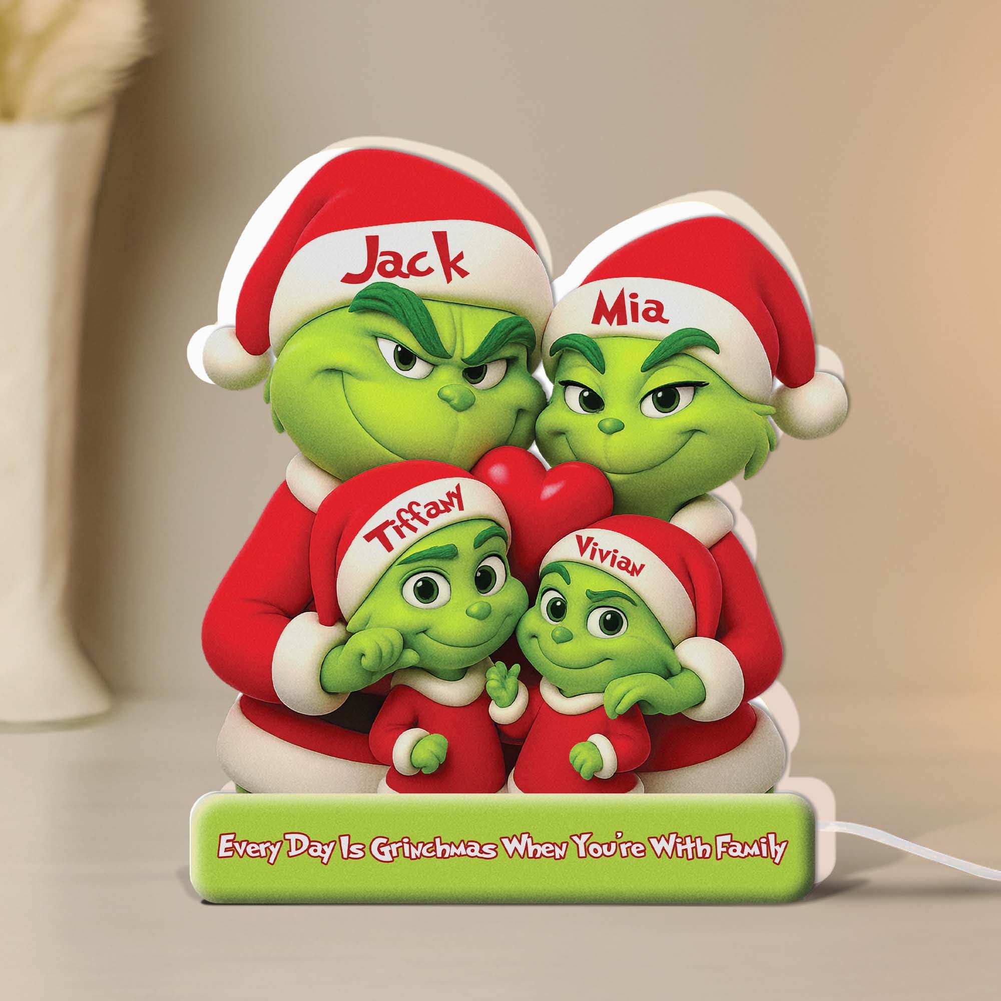 Personalized Grinch family light box featuring four Grinch characters in festive attire