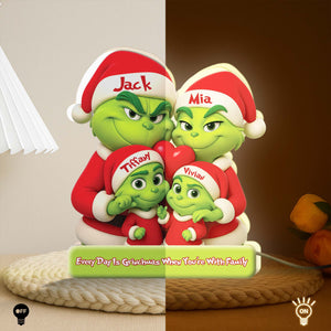 Personalized Grinch family light box featuring green Grinch characters wearing Santa hats for holiday decor