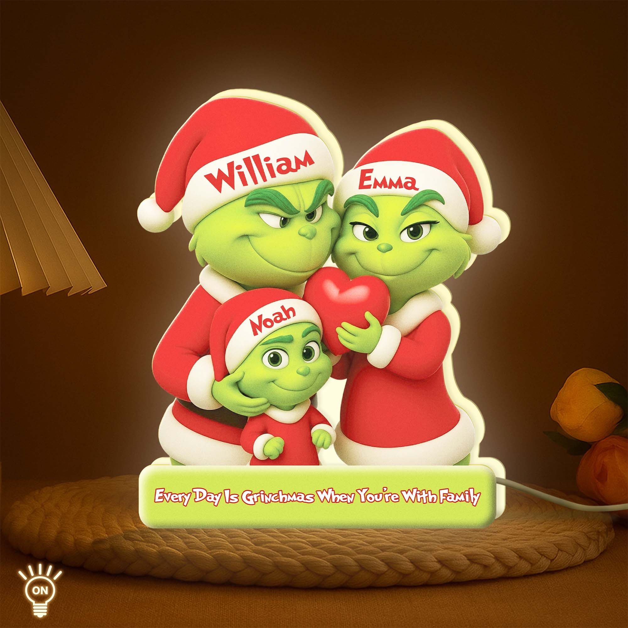 Personalized Grinch family light box featuring festive characters with names William, Emma, and Noah