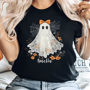 Black personalized Halloween shirt with white ghost, orange bow, spider webs, flowers, and name Amelia