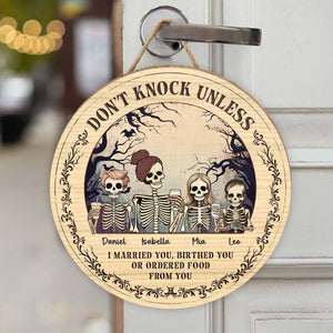 Personalized Halloween wooden door sign featuring skeletons and playful text for festive decor