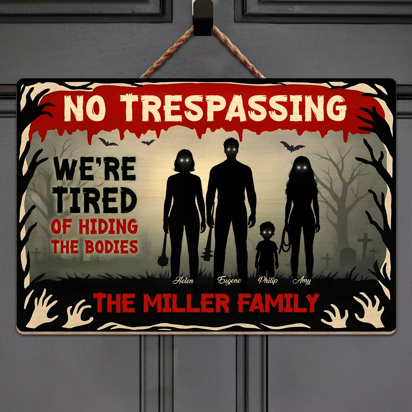 Halloween Wooden Door Sign showing No Trespassing silhouette family graveyard bats and text reading Were tired of hiding bodies