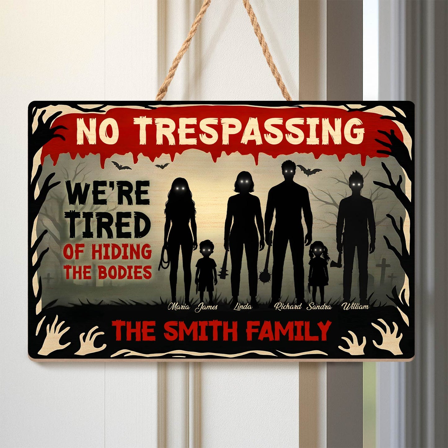 Halloween Wooden Door Sign featuring No Trespassing text silhouetted spooky family and graveyard scene
