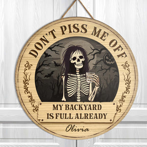 Personalized Halloween wooden door sign featuring a skeleton with a humorous phrase and spooky background