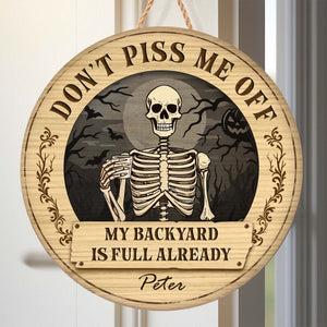 Personalized Halloween wooden door sign featuring a skeleton and spooky decor for festive decoration