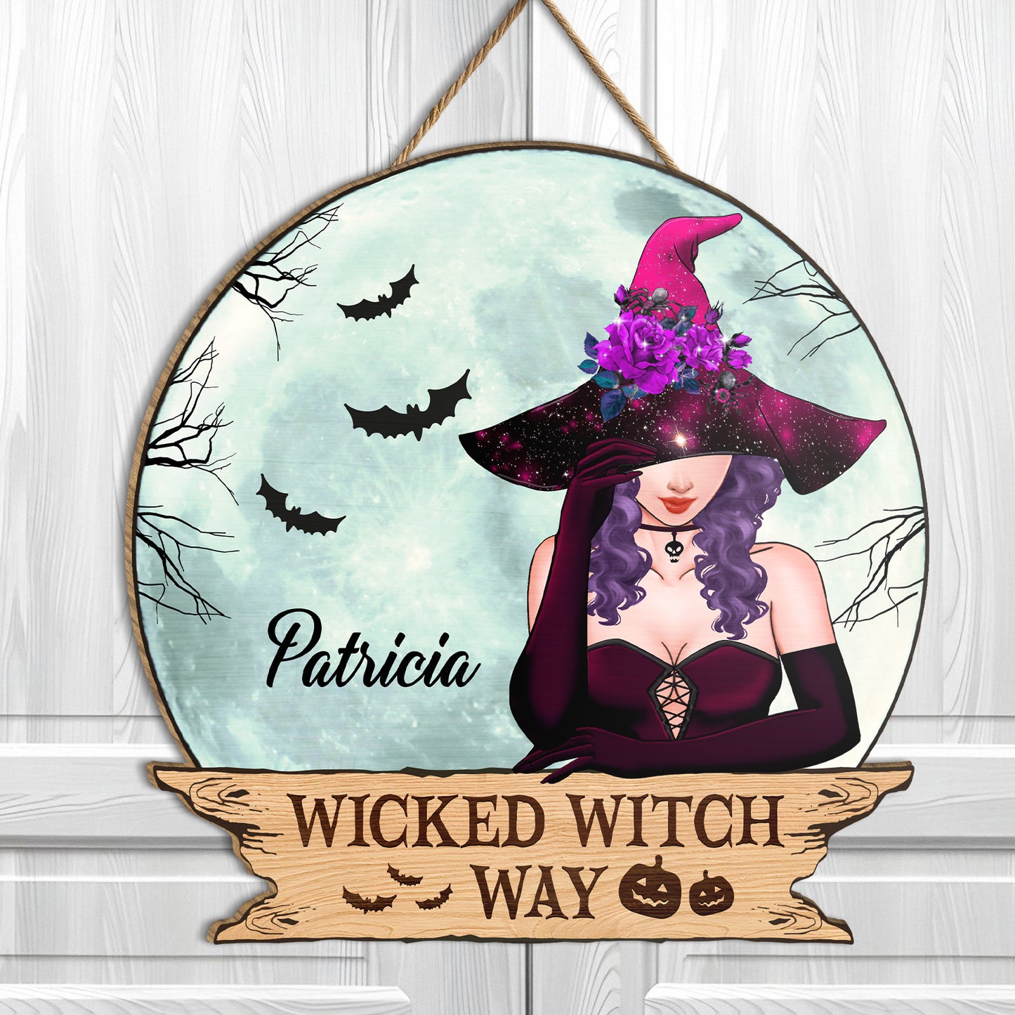 Personalized Halloween wooden door sign featuring a witch design with bats and space-themed elements