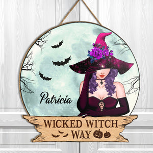 Personalized Halloween wooden door sign featuring a witch design with bats and space-themed elements