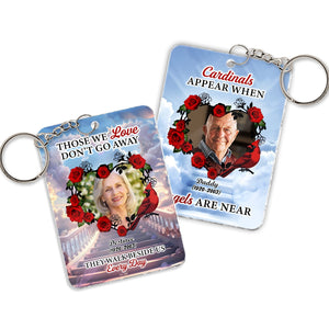 Personalized memorial keychain featuring a photo and heartfelt text with floral designs
