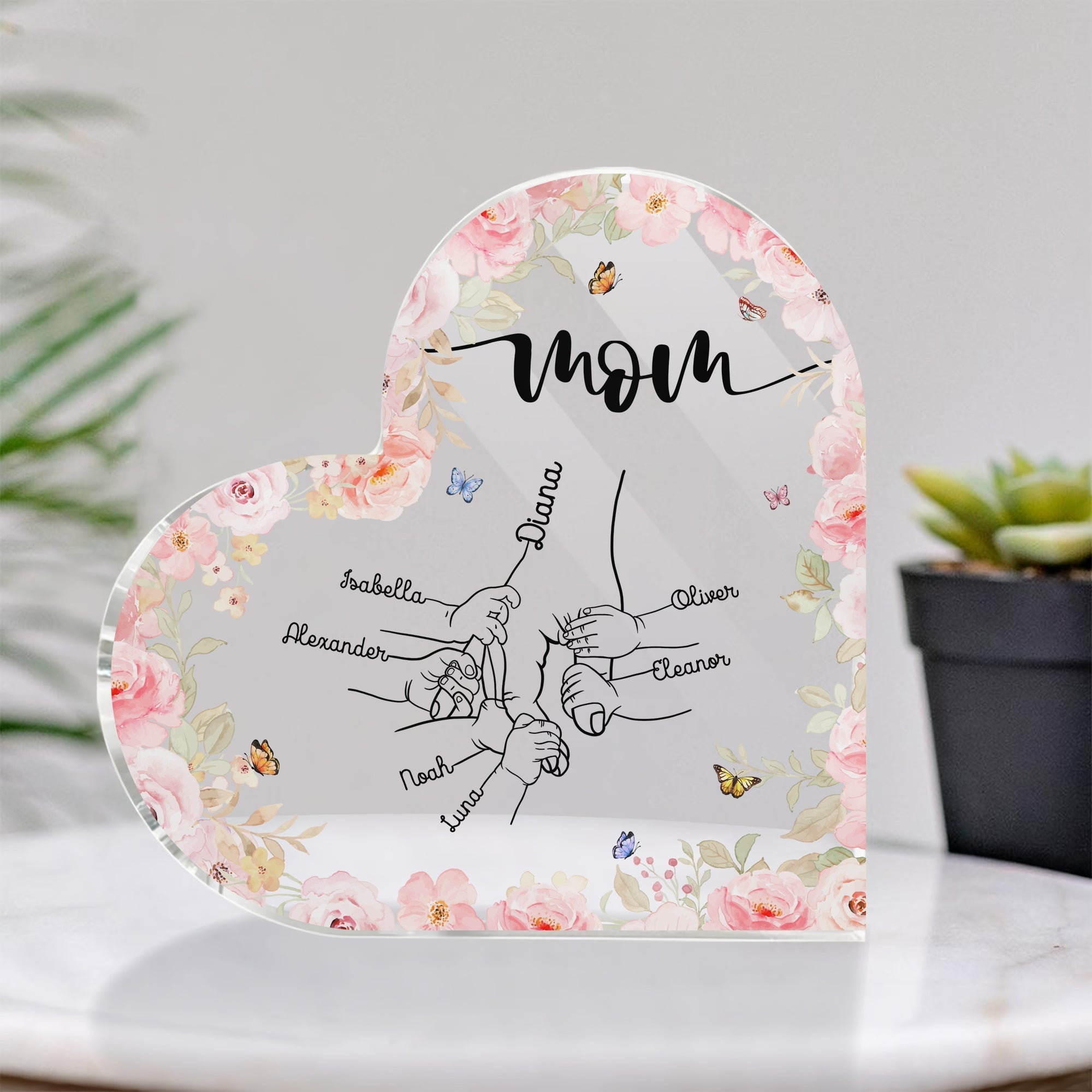 Personalized mom acrylic plaque featuring family names with floral design and heart shape