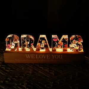 Personalized mom birth LED Light with floral letters spelling GRAMS on a wooden base