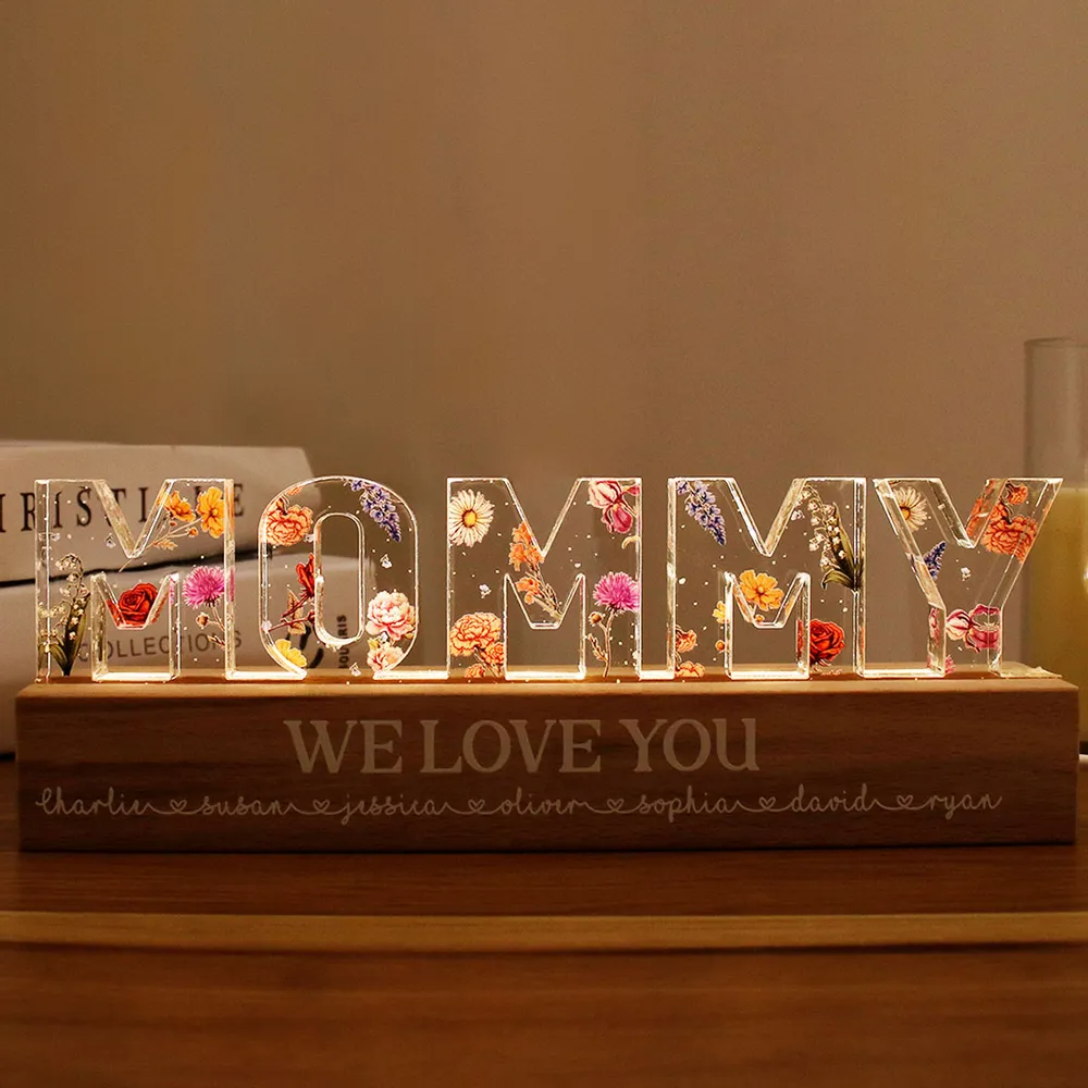 Personalized mom birth LED Light with floral accents illuminating the word Mommy on a decorative base