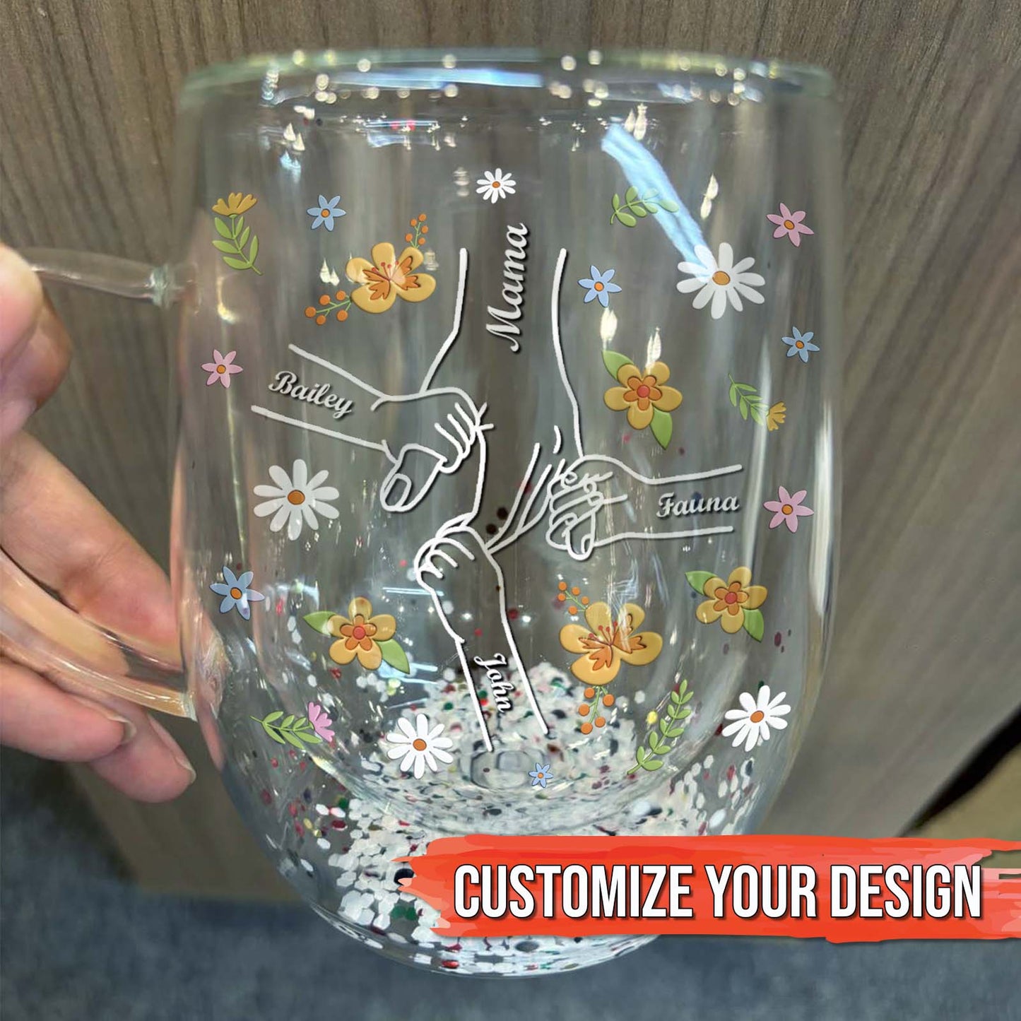 Personalized mom mug featuring floral design and hands holding names for a unique gift