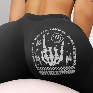 Black personalized motherhood leggings featuring a bold graphic design for active moms