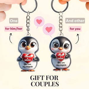 Personalized penguin couple keychain featuring cute penguins holding hearts for couples