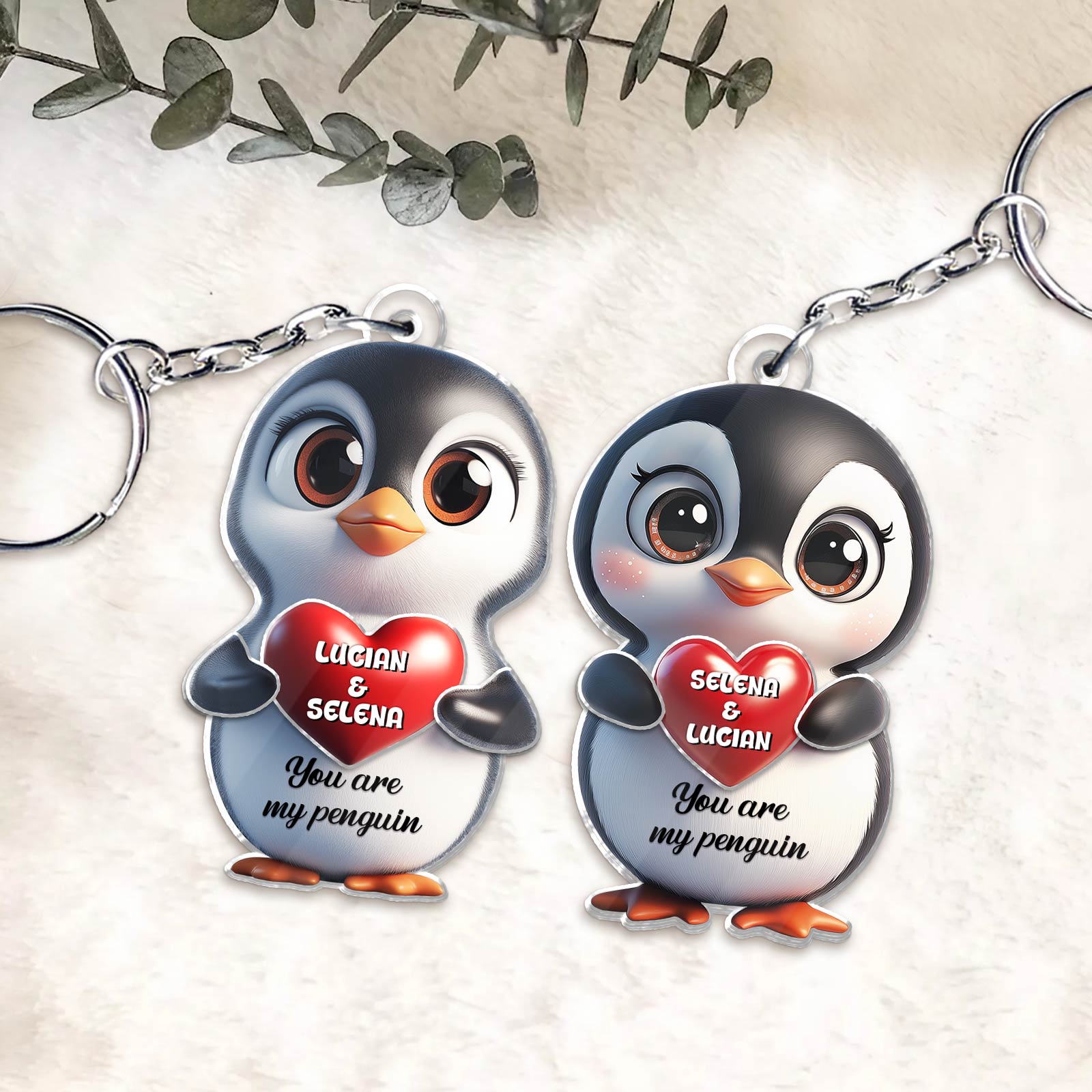 Personalized penguin couple keychain featuring cute penguins holding hearts with names and a sweet message