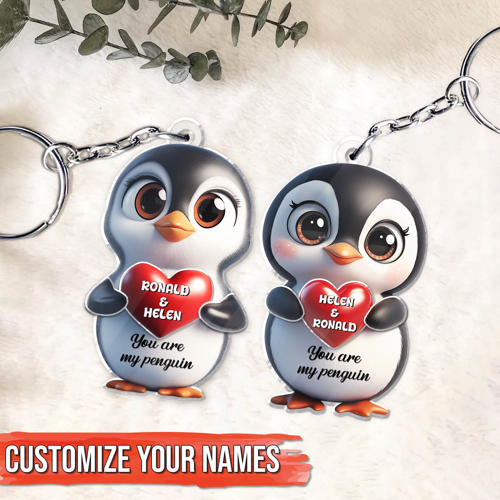Personalized penguin couple keychain featuring custom names and heart designs for a unique gift