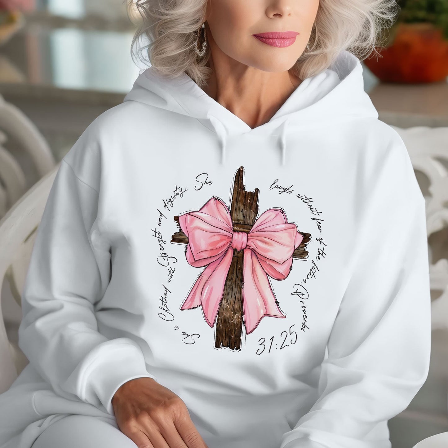White hoodie featuring a personalized pink bow t-shirt design with wood cross and scripture text