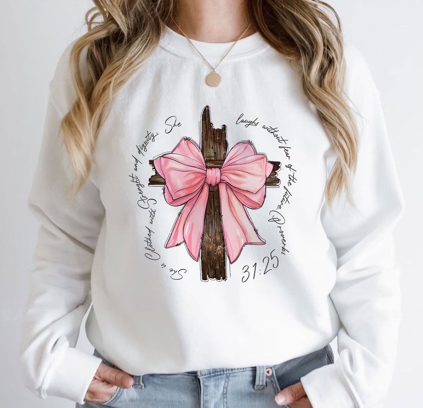 White sweatshirt with personalized pink bow t-shirt design featuring a wooden cross and scripture text