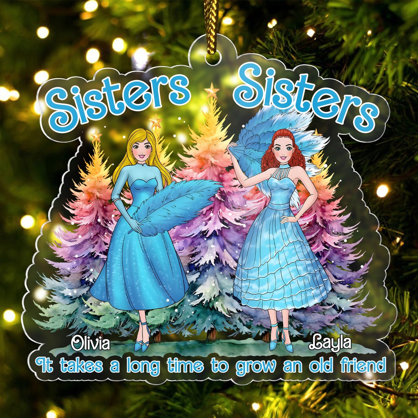 Personalized sisters Christmas ornament with two sisters in blue dresses and colorful trees background