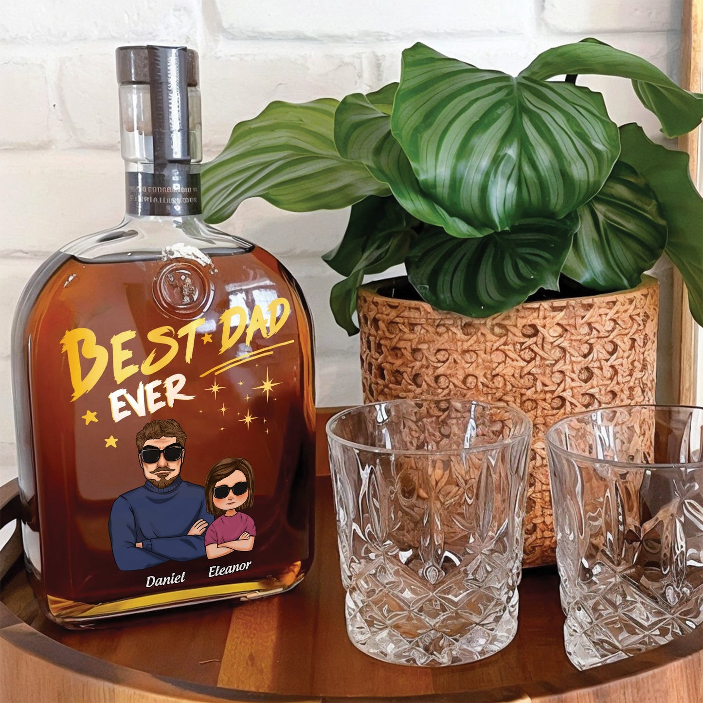 Personalized whiskey bottle gift for Dad with custom engraving and glasses on a wooden table