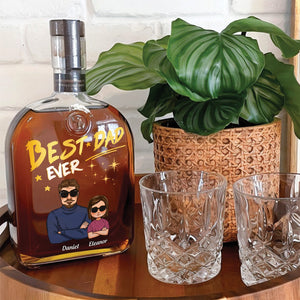 Personalized whiskey bottle gift for Dad with custom engraving and glasses on a wooden table