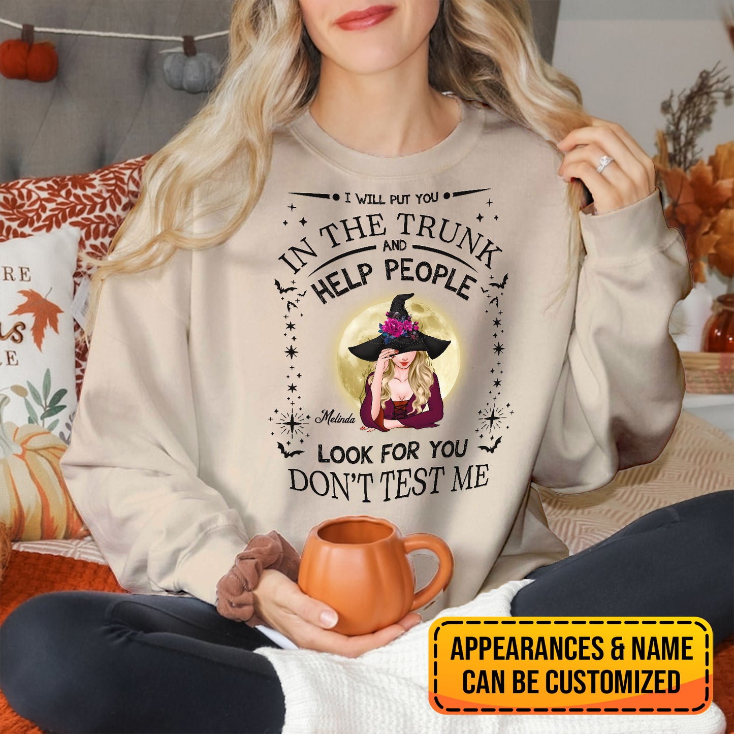 Woman wearing personalized witch Halloween sweatshirt with customizable name and Halloween-themed design