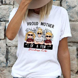 Women's T-shirt featuring the phrase proud mom of a few dumbass kids with cartoon kids graphics