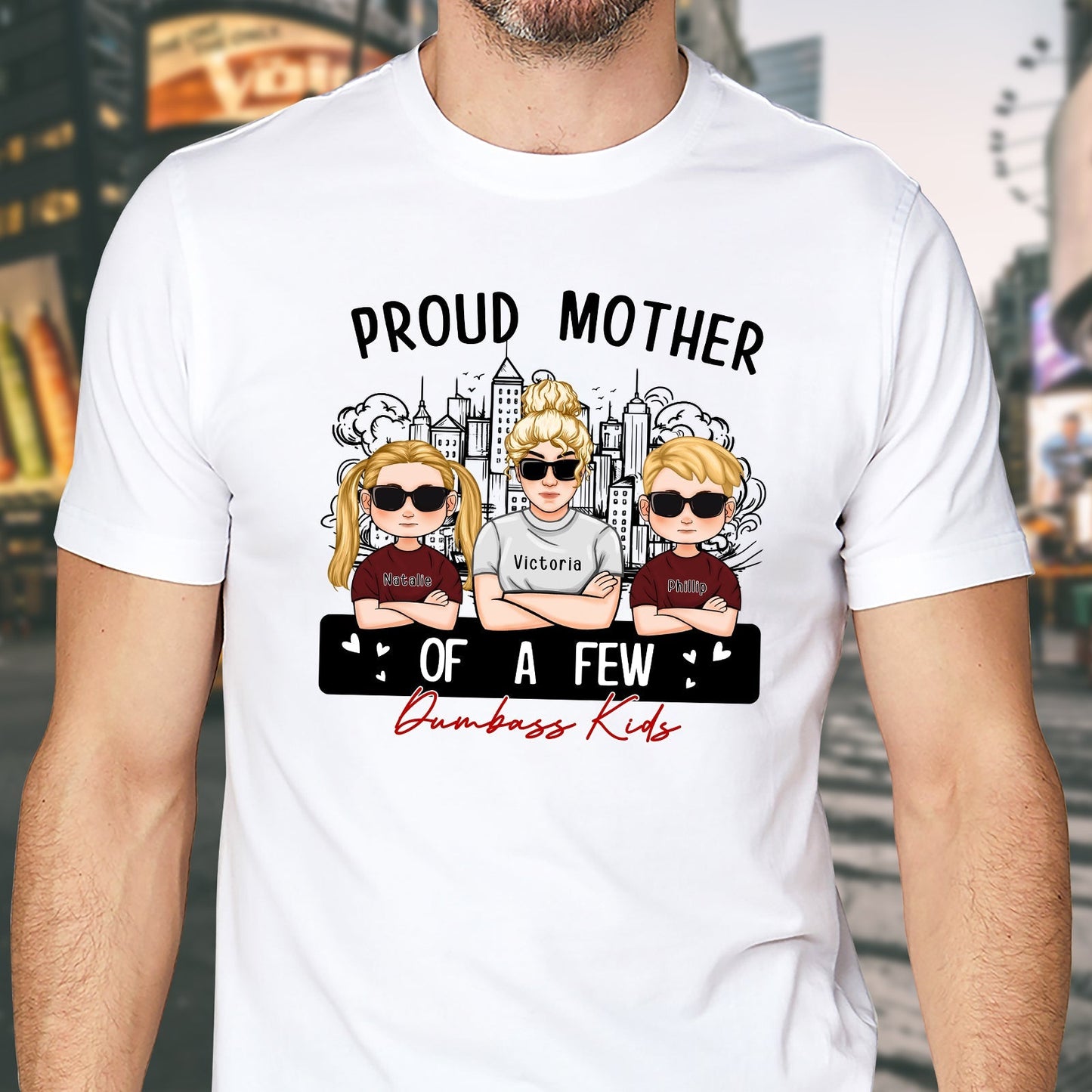 White T-shirt featuring a design that says proud mom of a few dumbass kids with cartoon characters