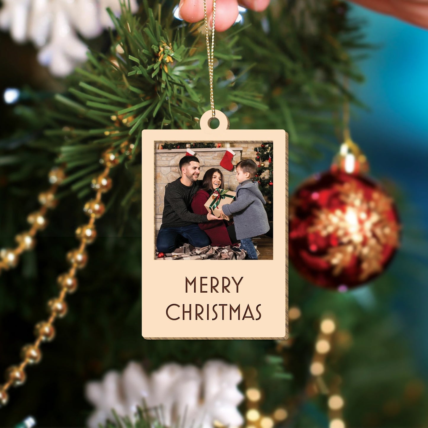 365Gifty personalized Christmas photo ornament hanging on tree with family photo and Merry Christmas text