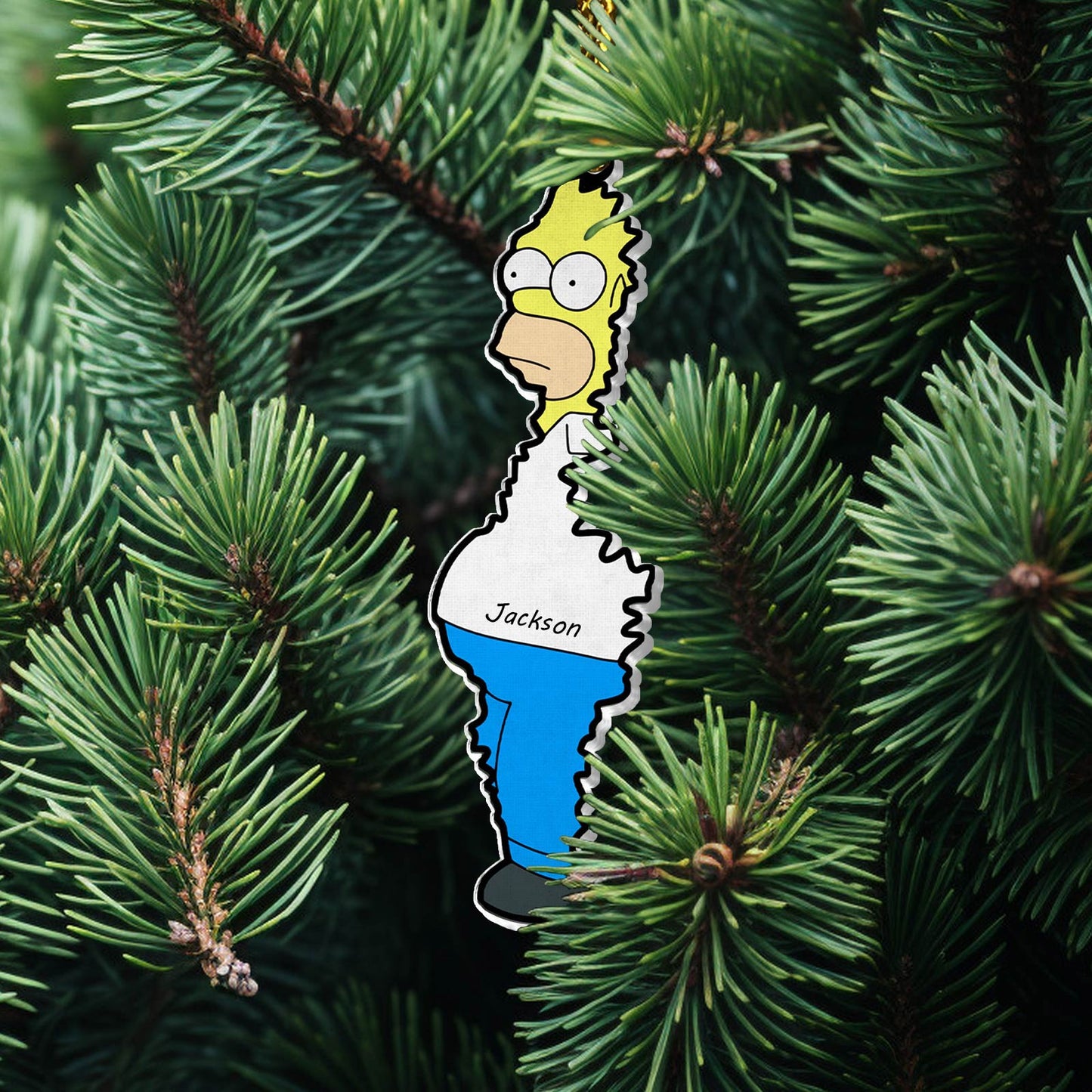 Personalized Christmas acrylic ornament featuring a cartoon character named Jackson hanging on green pine tree
