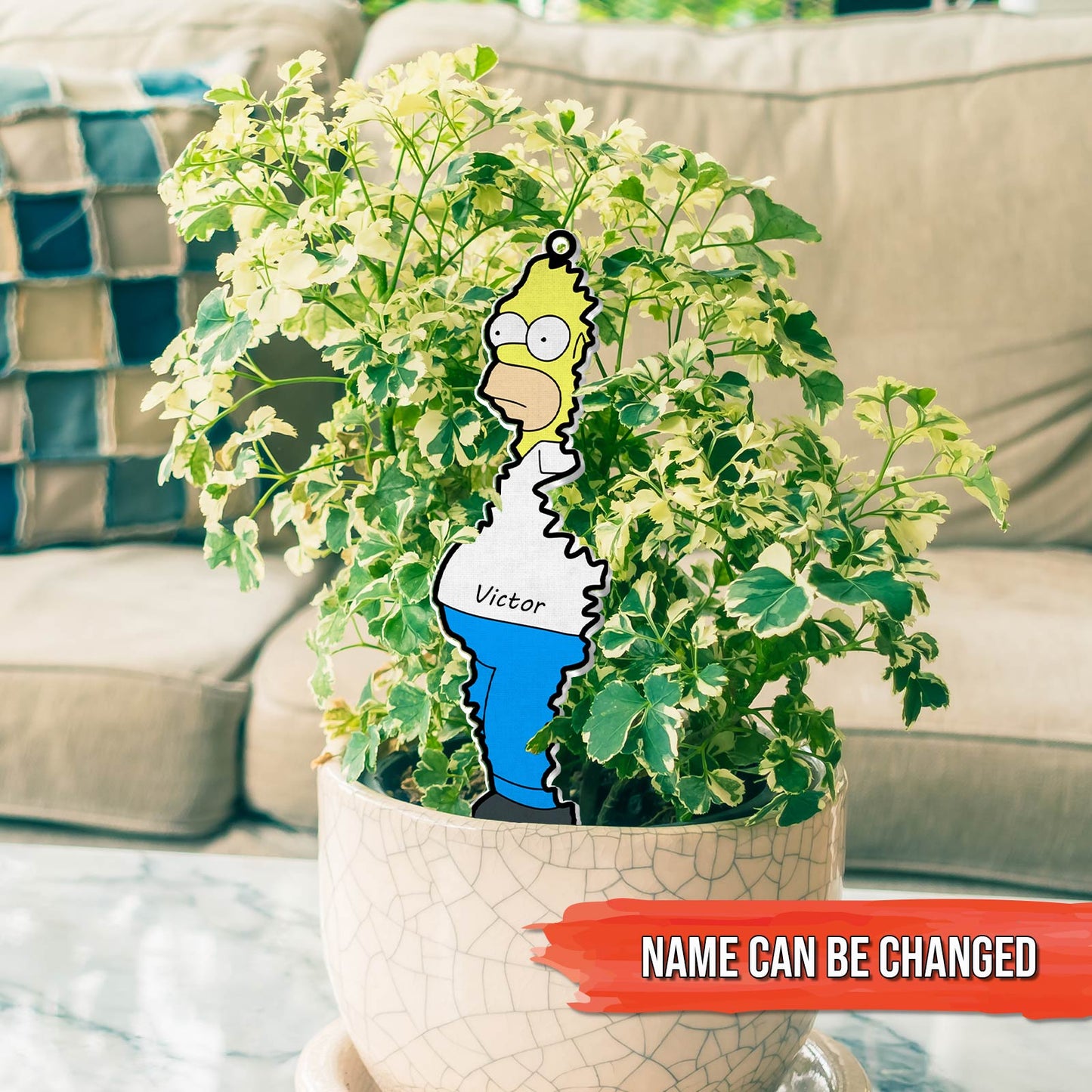 365Gifty personalized Christmas acrylic ornament featuring cartoon character Homer Simpson hanging on a green potted plant