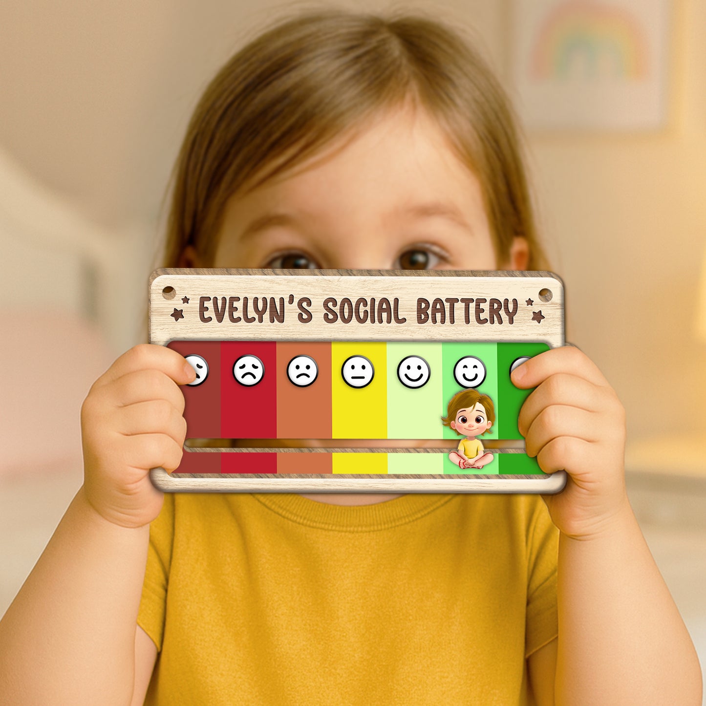 Child holding a wooden personalized door sign showing Evelyns social battery mood slider with emoji faces