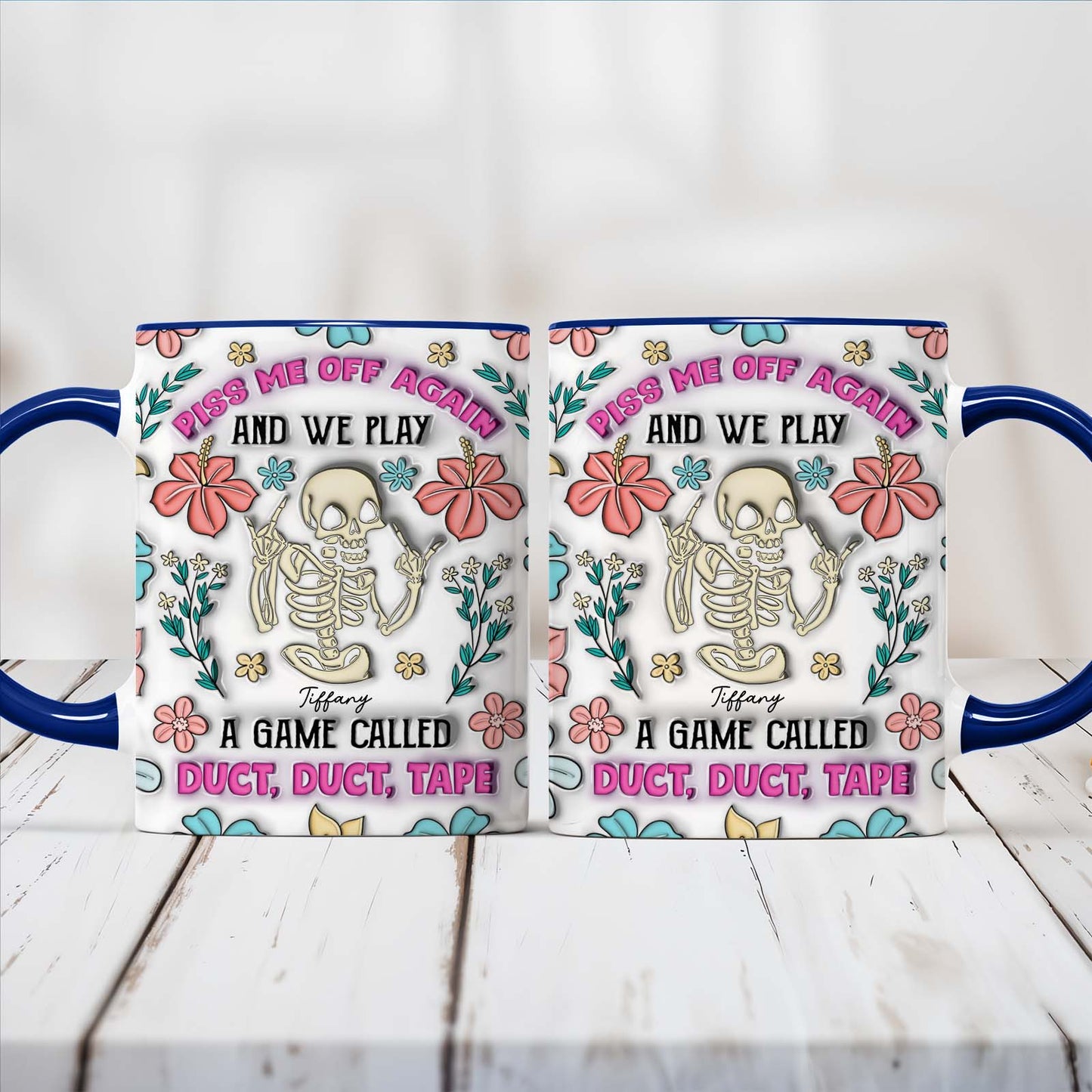 personalized halloween mug showing two white mugs with blue handles floral skeleton artwork and humorous duct tape game text