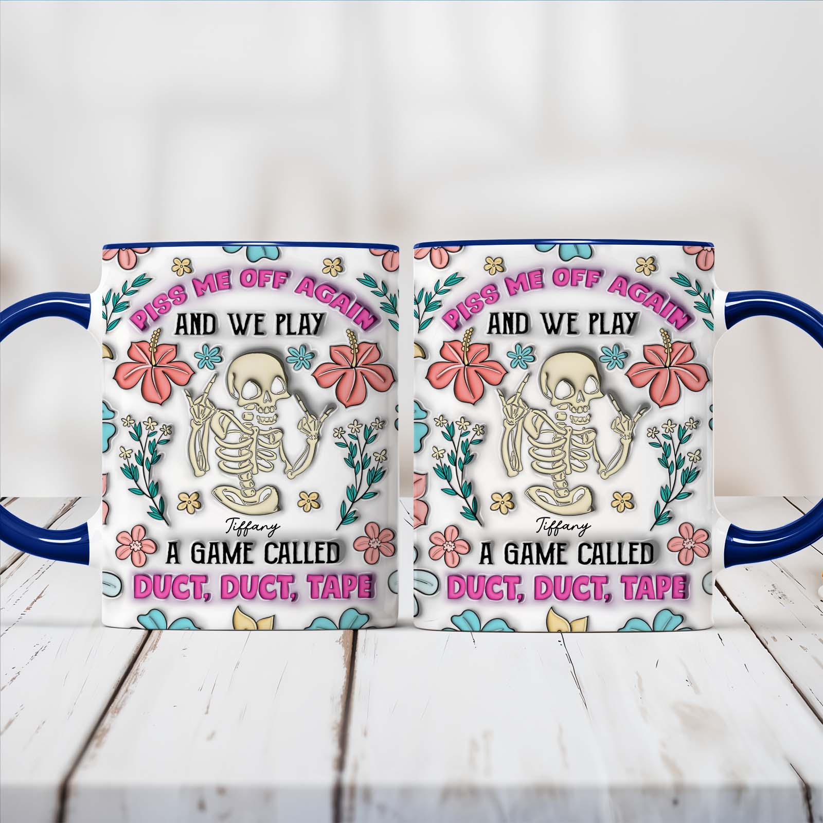 personalized halloween mug showing two white mugs with blue handles floral skeleton artwork and humorous duct tape game text