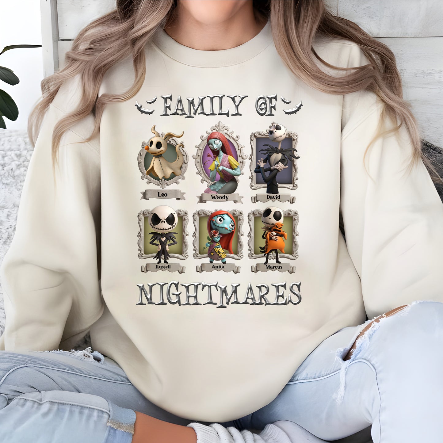 personalized halloween shirt cream sweatshirt with Family of Nightmares print showing six framed cartoon characters and names