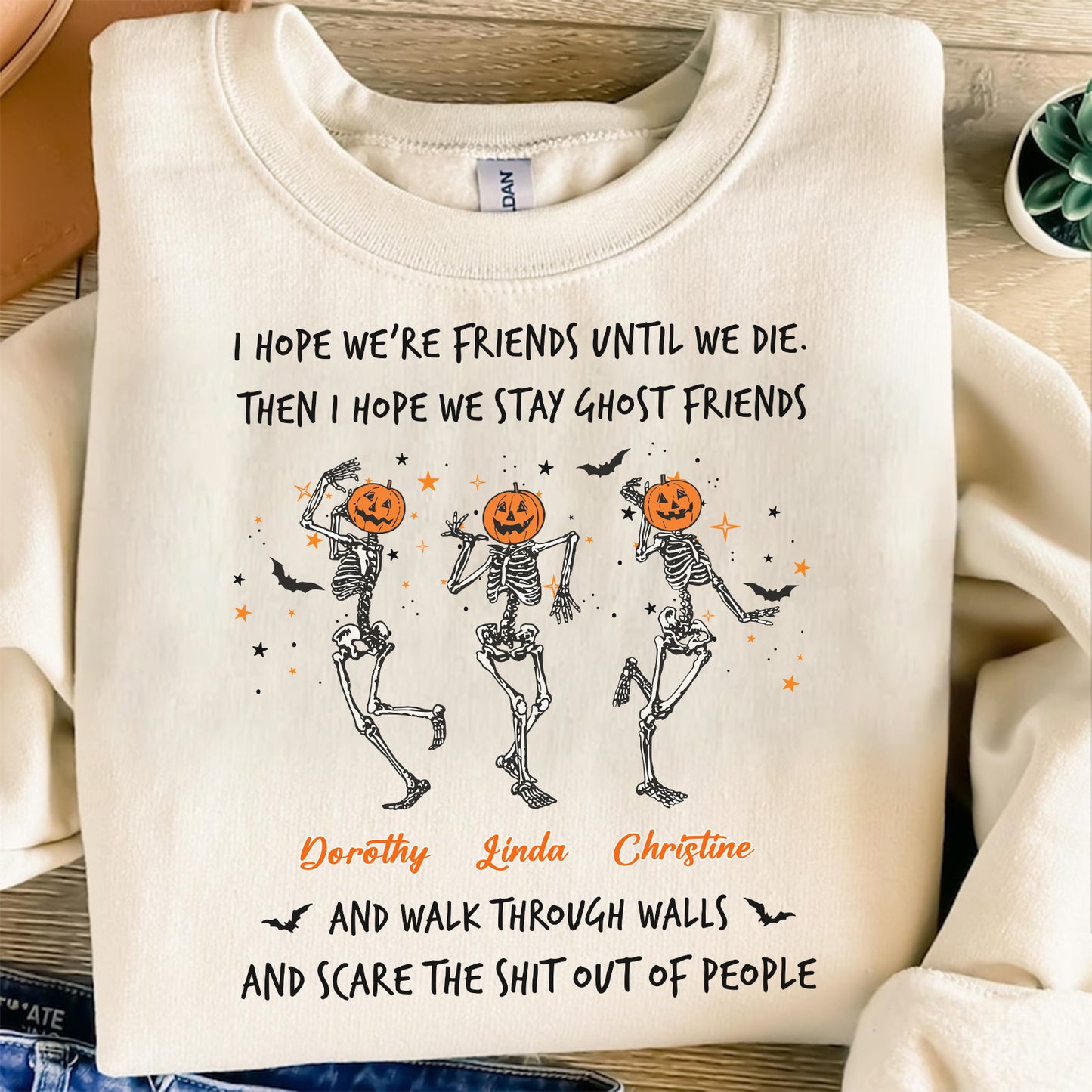 Cream custom best friend Halloween sweatshirt with three dancing skeletons with pumpkin heads and personalized names