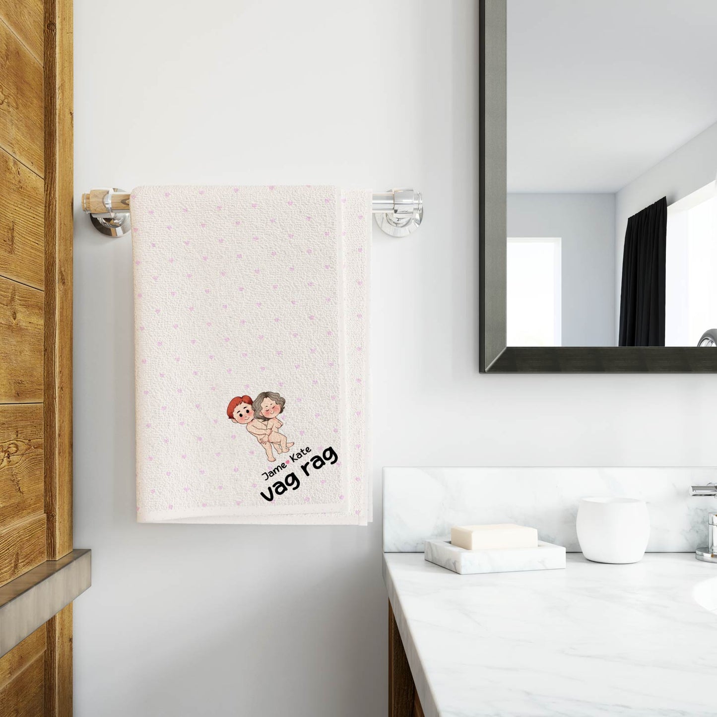 Personalized Beach Towel hanging on bathroom rack with cute custom cartoon couple design and name