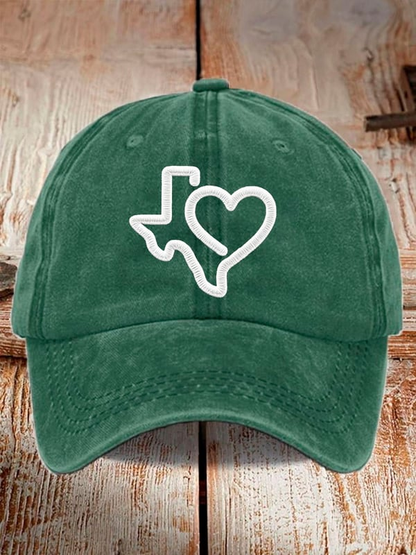 Green Texas strong baseball cap with white embroidered Texas state and heart design