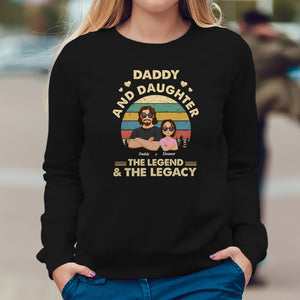 Black Daddy and Daughter the legend and the legacy shirt with a vintage sunset design and illustrated characters