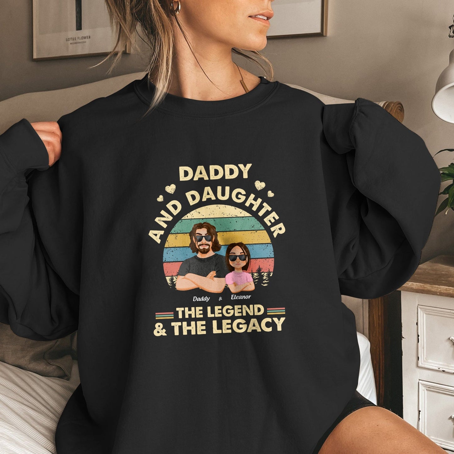 Black sweatshirt featuring the legend and the legacy shirt design with daddy and daughter graphic