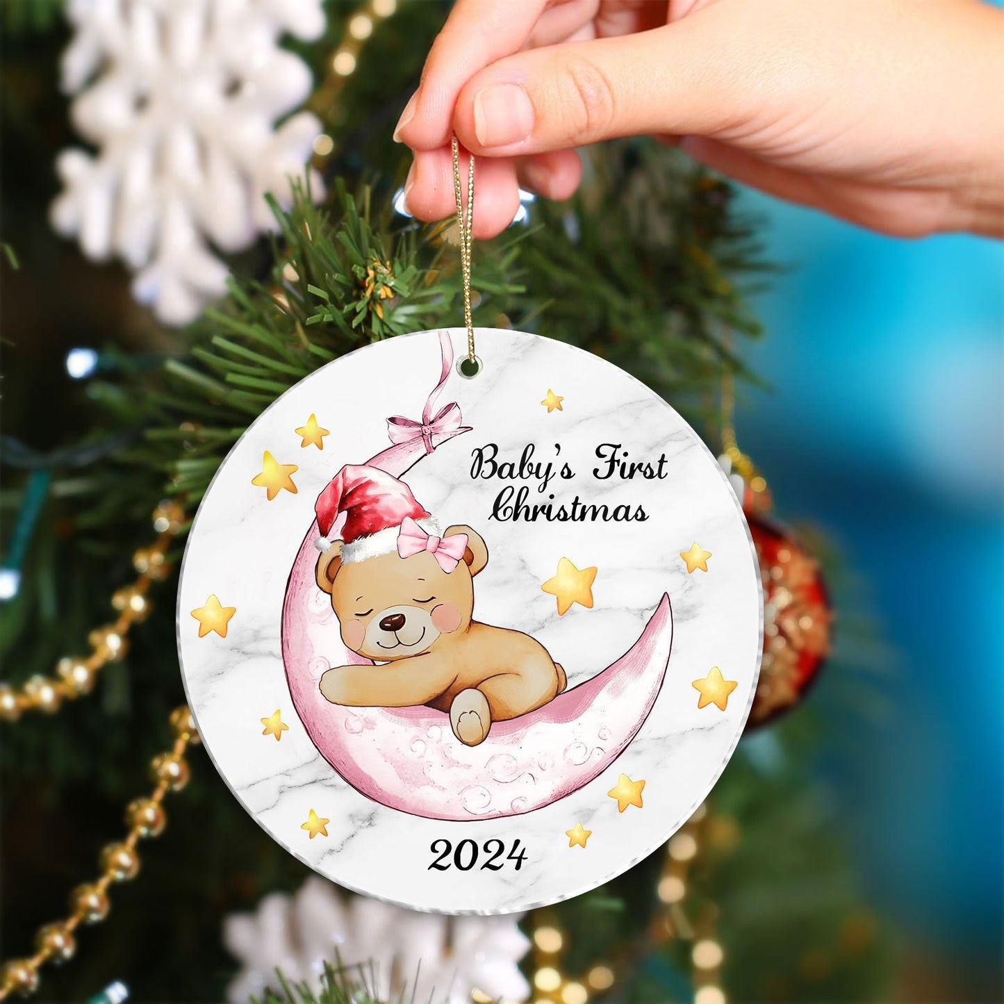 Unique baby Christmas gift ornament featuring a sleeping bear on a crescent moon with 2024 text