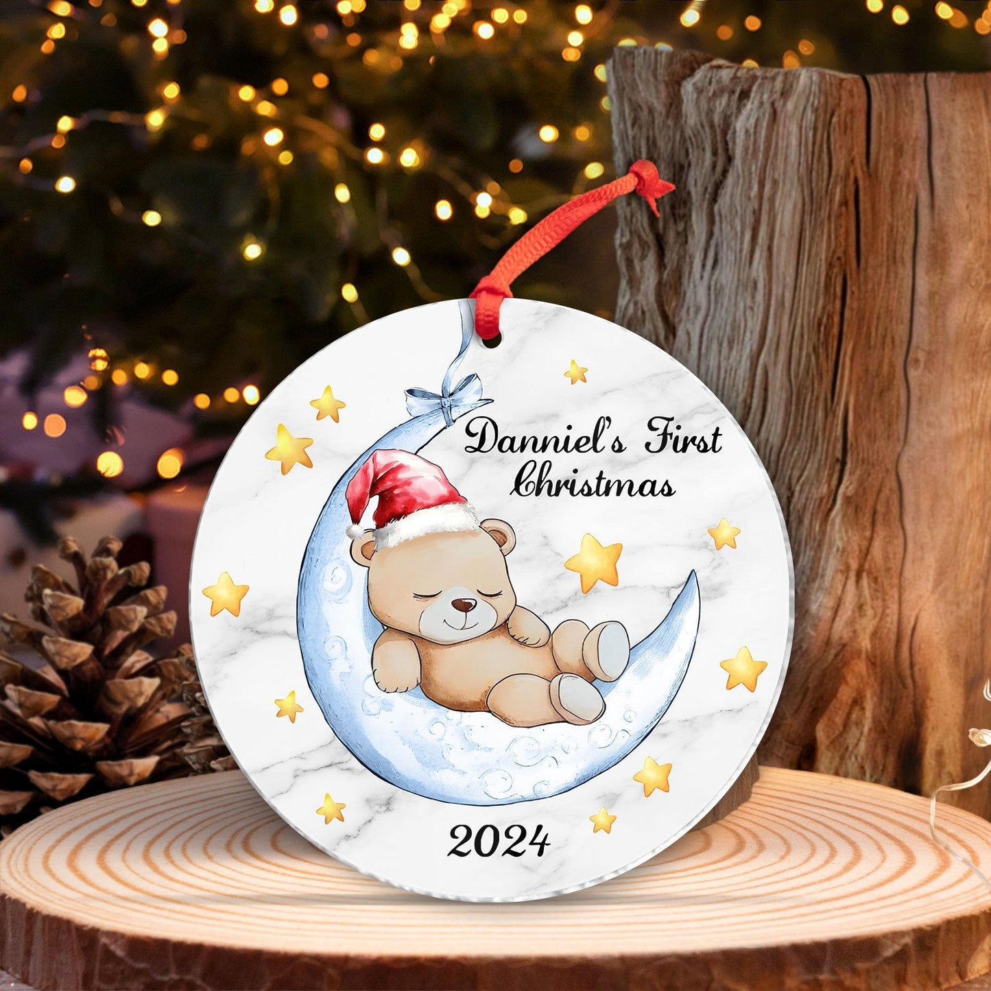 Unique baby Christmas gift ornament featuring a teddy bear sleeping on a crescent moon with stars and personalized text