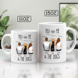 Unique pet lover gift mug featuring a couple and their dogs by the beach during sunset