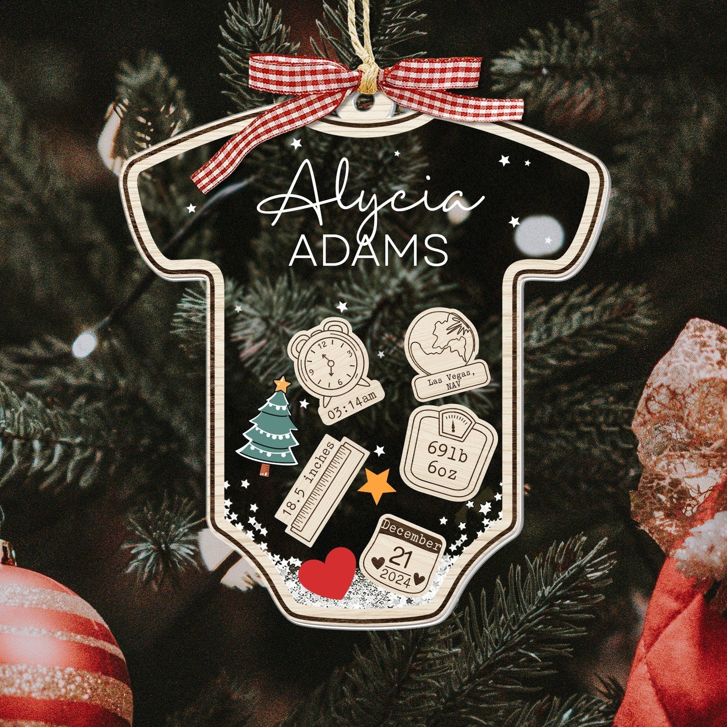 Personalized baby's first Christmas ornament shaped like a onesie with name Alycia Adams and birth details
