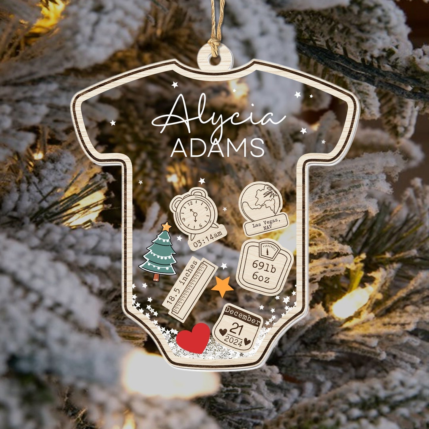 Personalized baby's first Christmas ornament shaped like a onesie with name and birth details