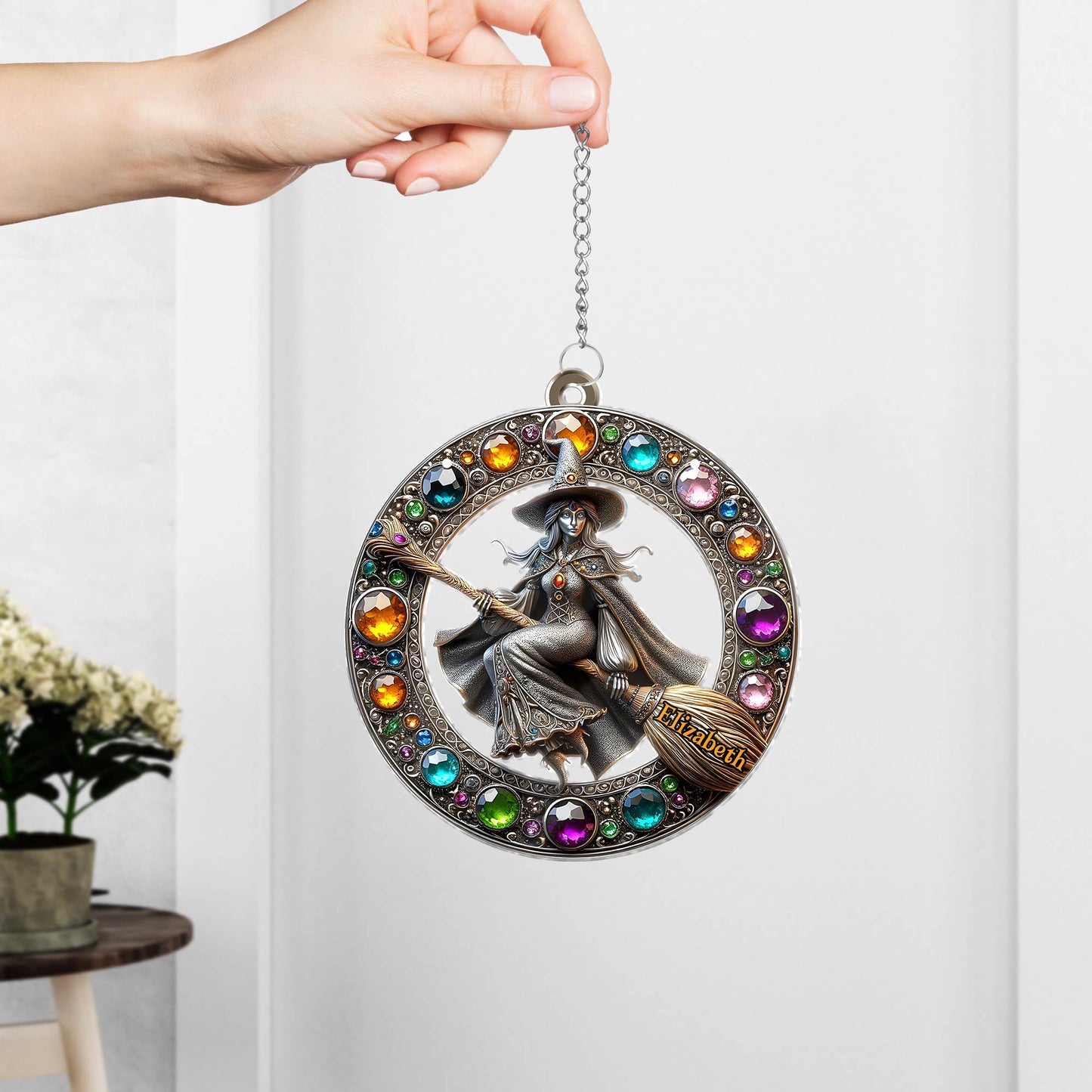 365Gifty personalized Halloween witch suncatcher featuring a witch on a broom with colorful gems in a circular frame